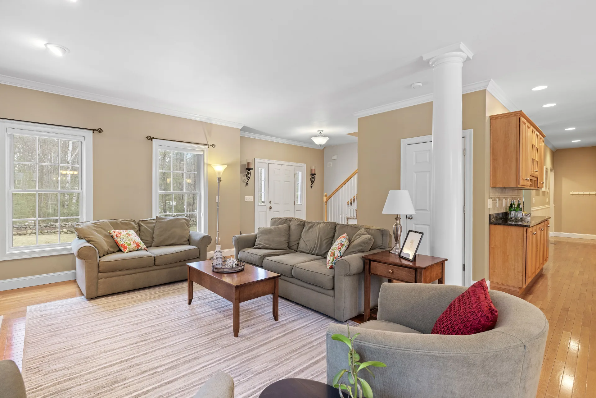 A living room with the cushions straightened and the floor clean